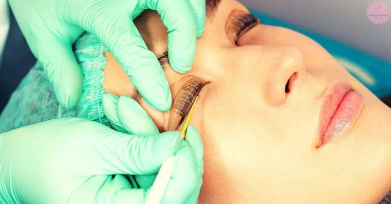 a professional applying an eyelash lift treatment using a specialized tool on a client’s upper eyelids.