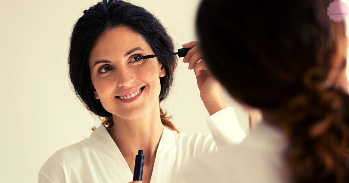 a professional applying mascara to enhance eyelashes for a fuller look during a beauty treatment session