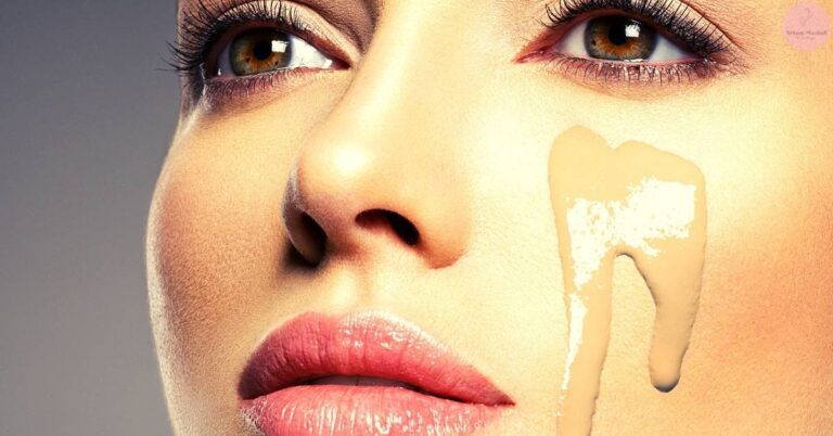 a close-up of a face highlighting a missing tooth area to illustrate foundation separation on skin, emphasizing uneven makeup application.