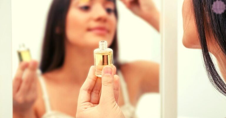 a person holding a small bottle of castor oil while examining their reflection, focusing on eyelash care