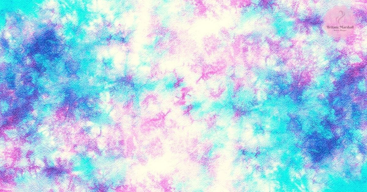 a vibrant abstract blend of pastel turquoise and lavender swirls illustrating the colorful, versatile results of tie-dye technique.