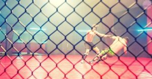two mixed martial artists engaged in a grappling exchange inside a caged octagon.
