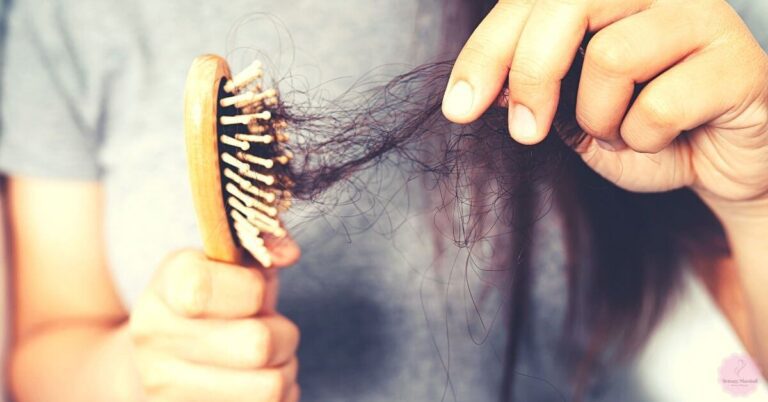 a close-up of hair being brushed out, showing significant breakage and thinning often associated with chemical hair treatment damage.