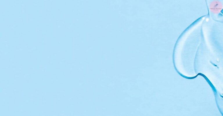 a close-up of a blue-toned skincare dropper bottle against a light background