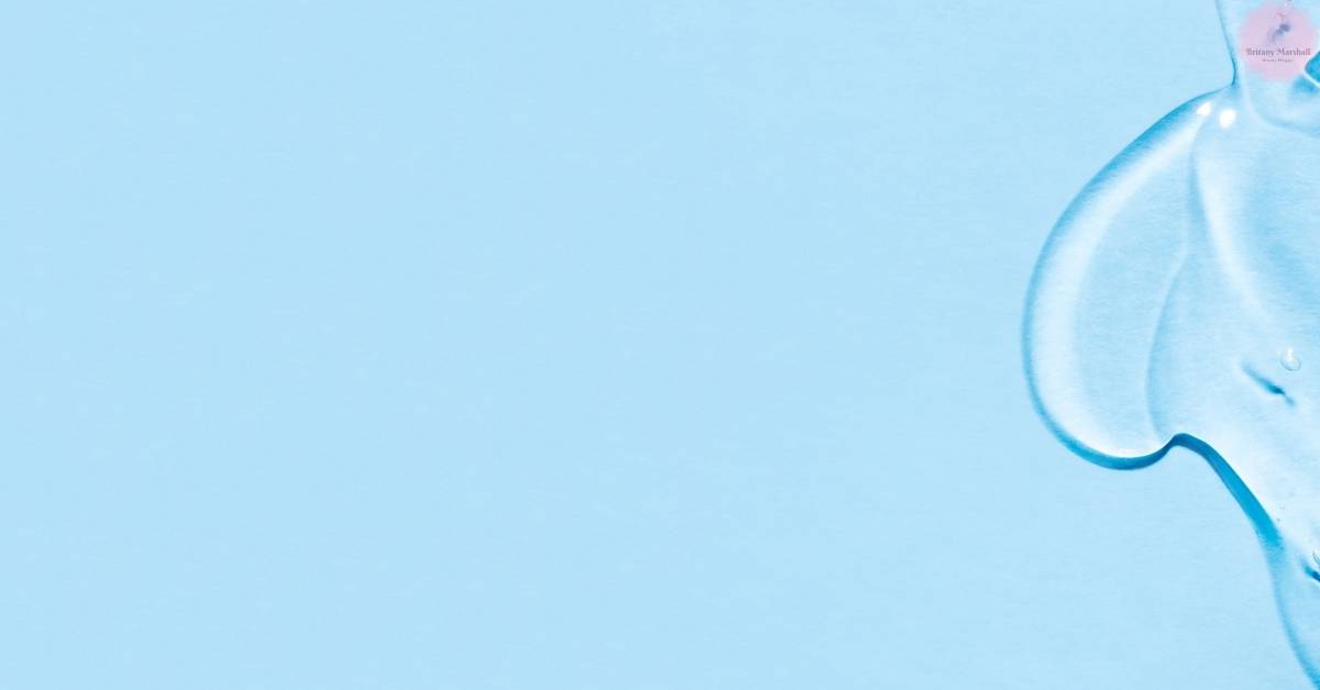 a close-up of a blue-toned skincare dropper bottle against a light background