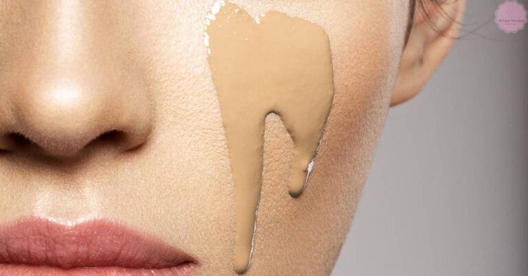 a close-up of skin with a liquid foundation product being applied to the cheek, highlighting texture and coverage for oily skin.