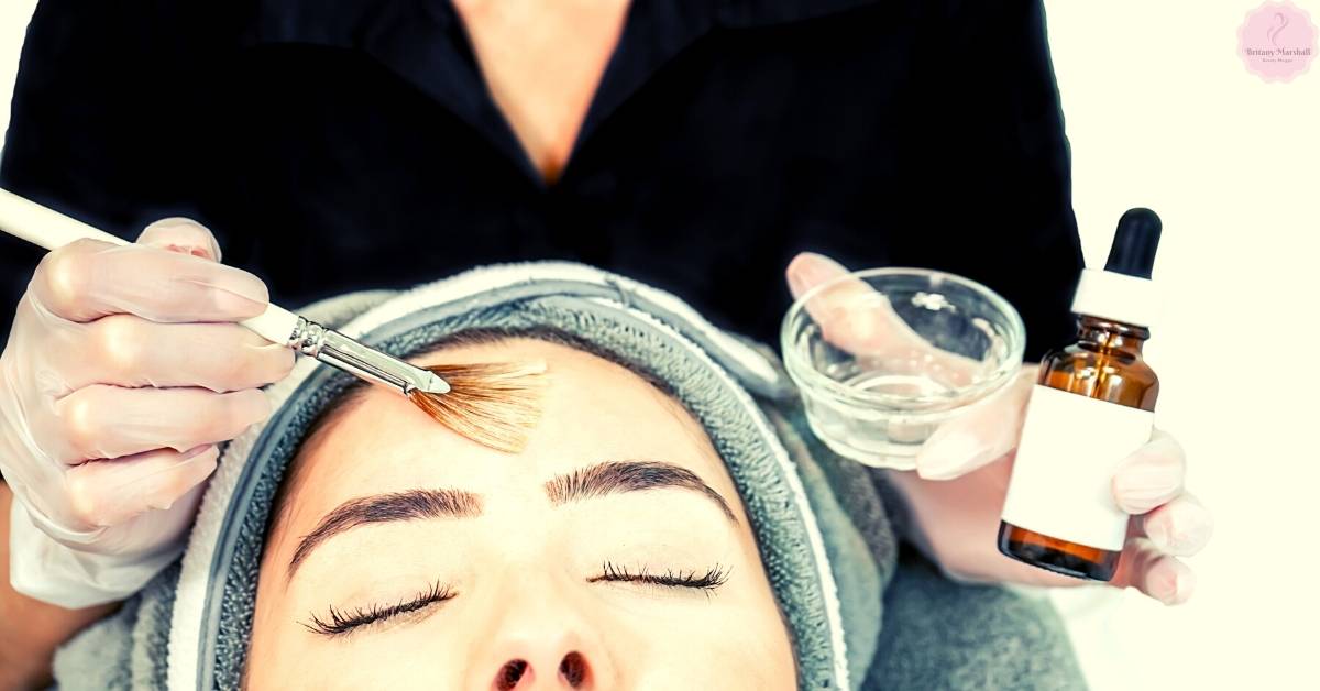 a person receiving a gentle facial treatment with a soft brush application, likely part of post-care for sensitive skin during the healing process after a chemical peel.