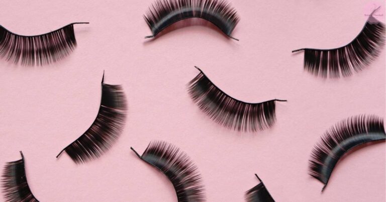 curved false eyelashes arranged on a pink background, showcasing reusable clean fake lashes