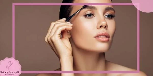a person applying an eyebrow makeup product with a precision brush for natural eyebrow enhancement