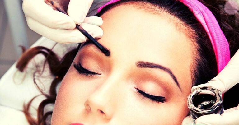 a person receiving a professional eyebrow tinting treatment to enhance natural eyebrow color and thickness