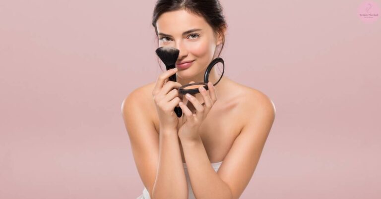 a woman applying makeup with a fluffy brush and compact mirror, focusing on long-lasting techniques.