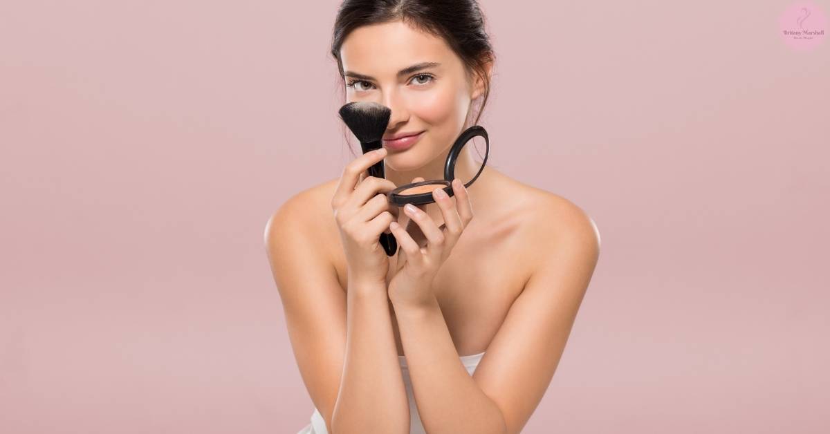 a woman applying makeup with a fluffy brush and compact mirror, focusing on long-lasting techniques.