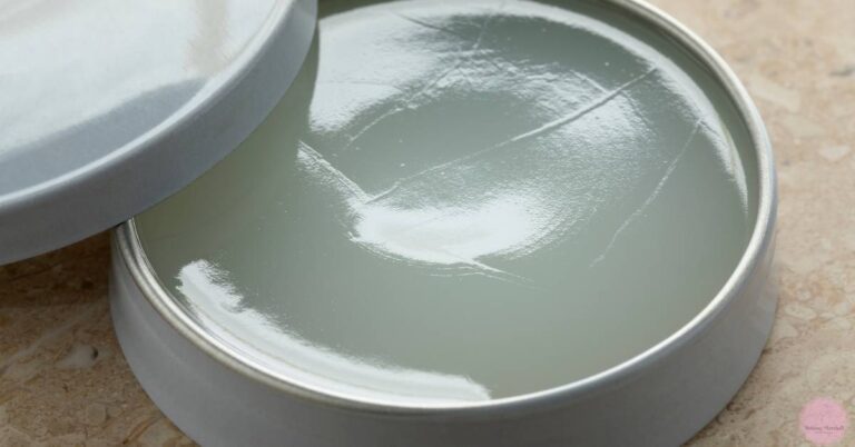 an open container of white petrolatum-based ointment with a smooth, thick texture.