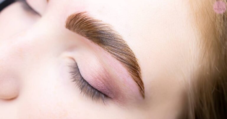 a close-up of a softly blended, gradient ombre brow technique applied with powder for a natural, seamless look.