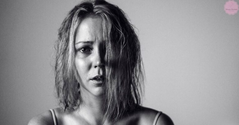 a person with wet, dehydrated-looking stringy hair framing their face