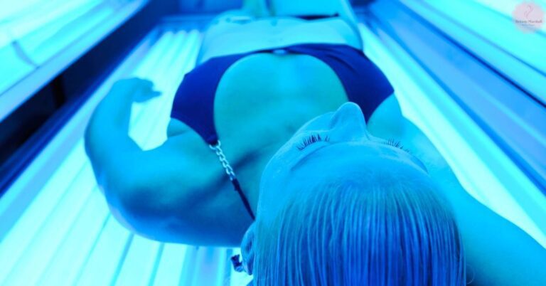 a person lying in a tanning bed with visible skin irritation on their back and shoulder