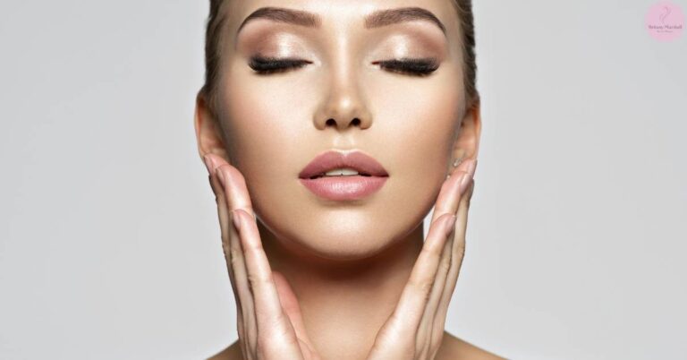a person gently holding their face to illustrate potential skin sensitivity or dryness during the initial stages of using prescription retinoids