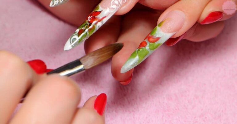 a close-up of hands applying detailed floral nail art using a fine kolinsky sable hair nail art brush on acrylic nails.
