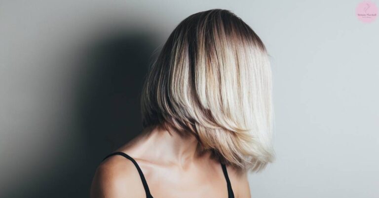 a person with shoulder-length, layered fine hair styled in tousled, textured waves for added volume.