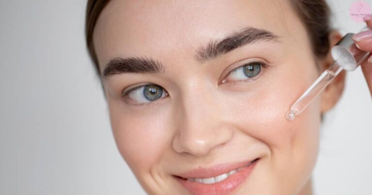a person applying eyelash growth serum with a dropper near their closed eye, showcasing easy application.
