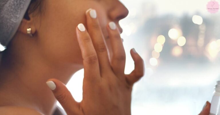 a person applying a brightening skincare product with hands cupped under face, showcasing a glowing, hydrated complexion.
