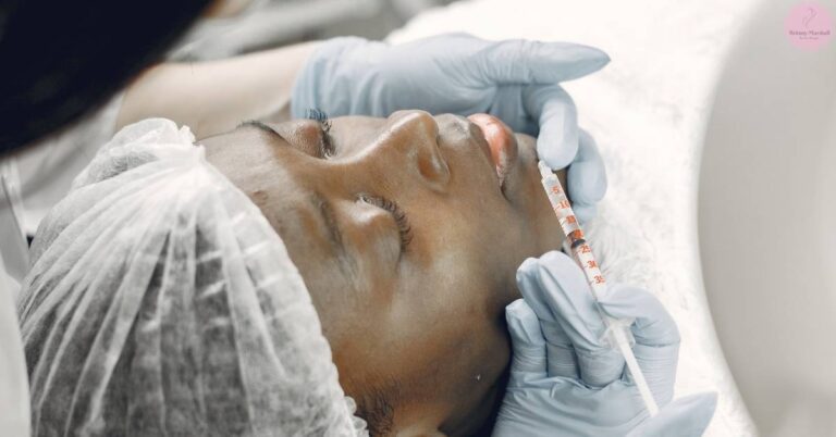 a person receiving a hyaluronic acid lip filler injection with a syringe during a cosmetic procedure.
