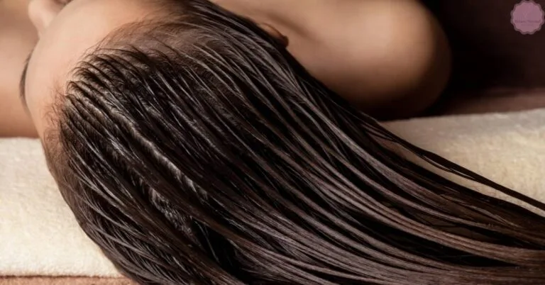 a person’s long hair tangled and matted, likely from residue like hair glue, lying flat on a surface