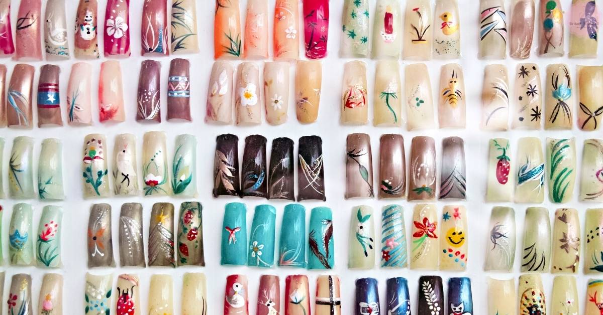a creative assortment of hand-painted acrylic nail art designs showcasing floral, animal, and abstract patterns for nail enthusiasts exploring starter kits.