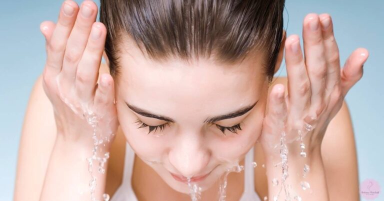a person gently washing their face with water streams, emphasizing careful eyebrow area cleaning for proper microblading aftercare
