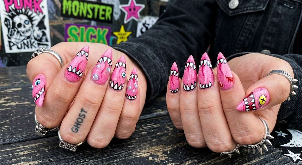 Goofy nails design with sharp cartoon monster teeth painted along tip edges