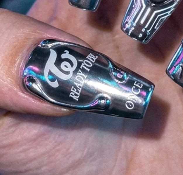 TWICE Strategy concert-ready long coffin press-on nails with cyber silver metallic chrome ombré and rhinestone clusters (AI Generated Image)