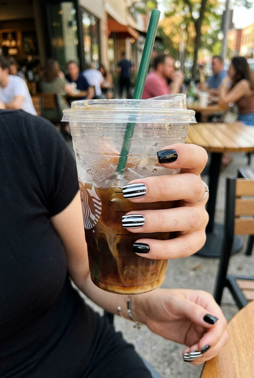 10 Cute & Simple Halloween Nails for Short Nails (Easy 2026 Inspo) 19 7. High-Contrast Black & White Beetlejuice Pinstripes - simple halloween nails (AI Generated Image)