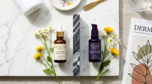 Luxury aesthetic vanity flatlay showing amber dropper bottle of Glycolic Acid and dark bottle of Retinoid Serum separated by a marble safety divider.
