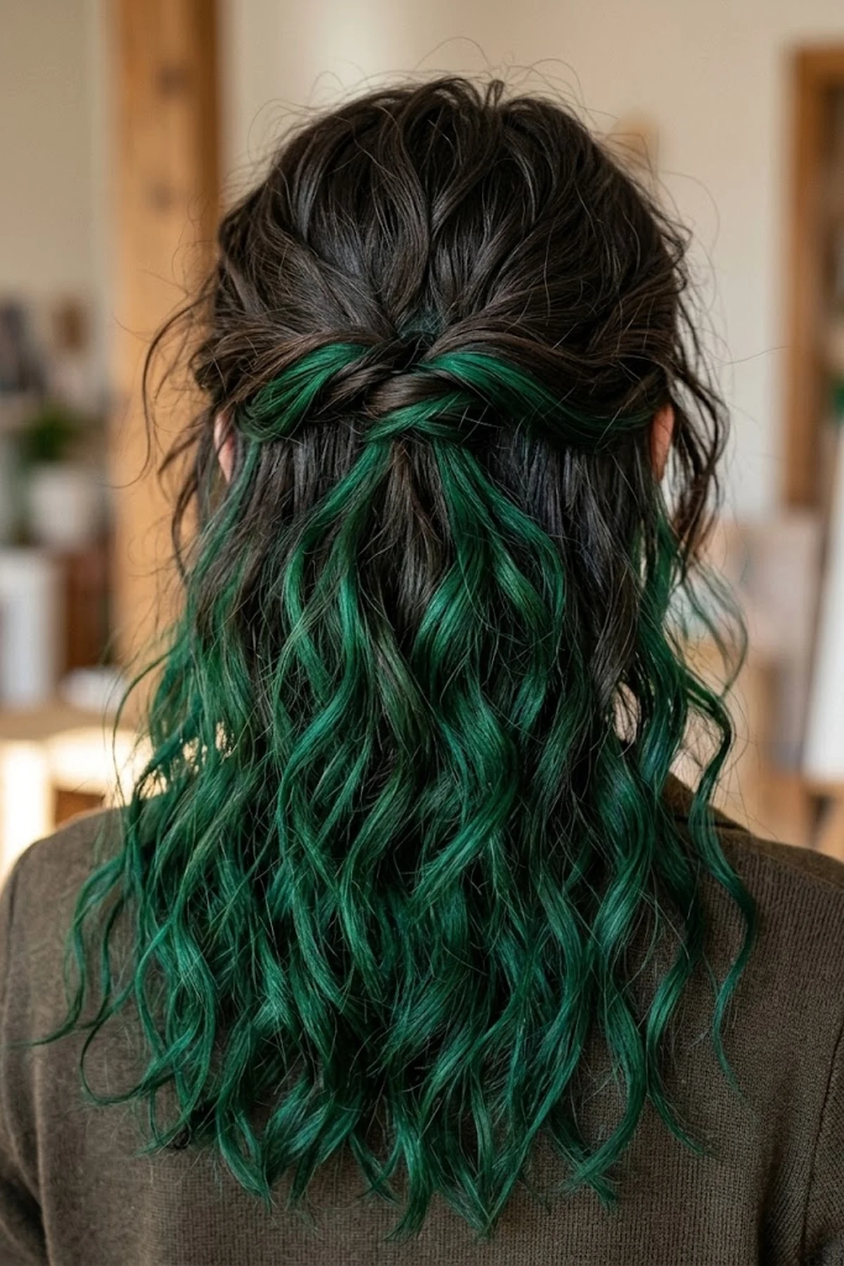 Back-view beauty photo of dark wavy hair styled half-up revealing vivid emerald green wash-out hair makeup wax on the underlayer (AI Generated Image)